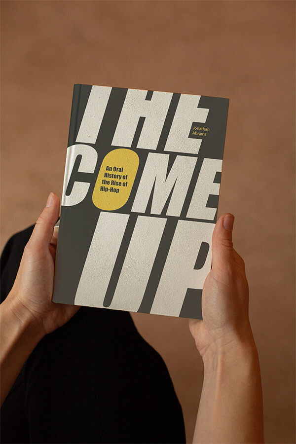 The Come Up book mockup held in hand