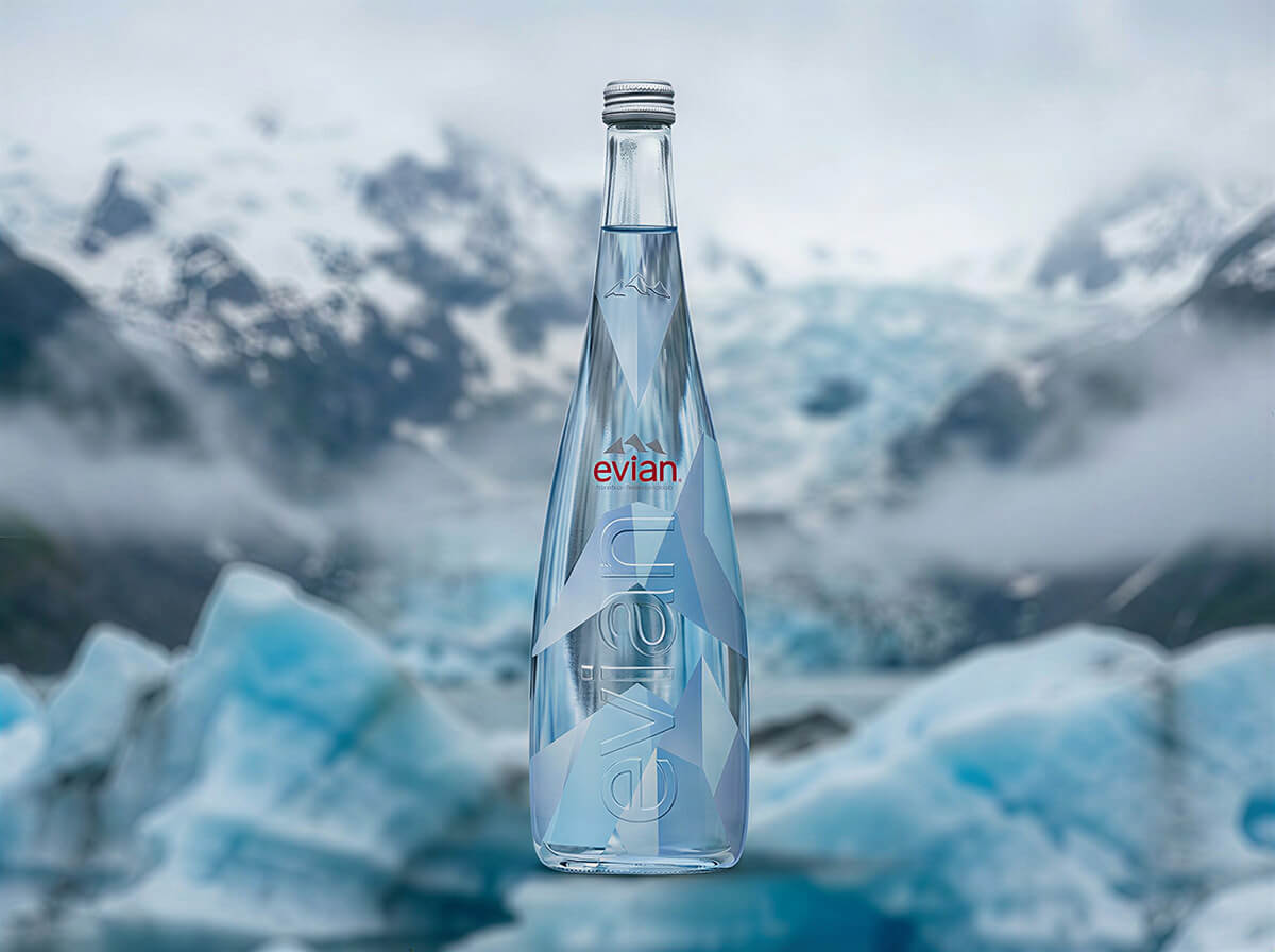 Evian bottle packaging mockup placed in a cool-toned mountain landscape setting