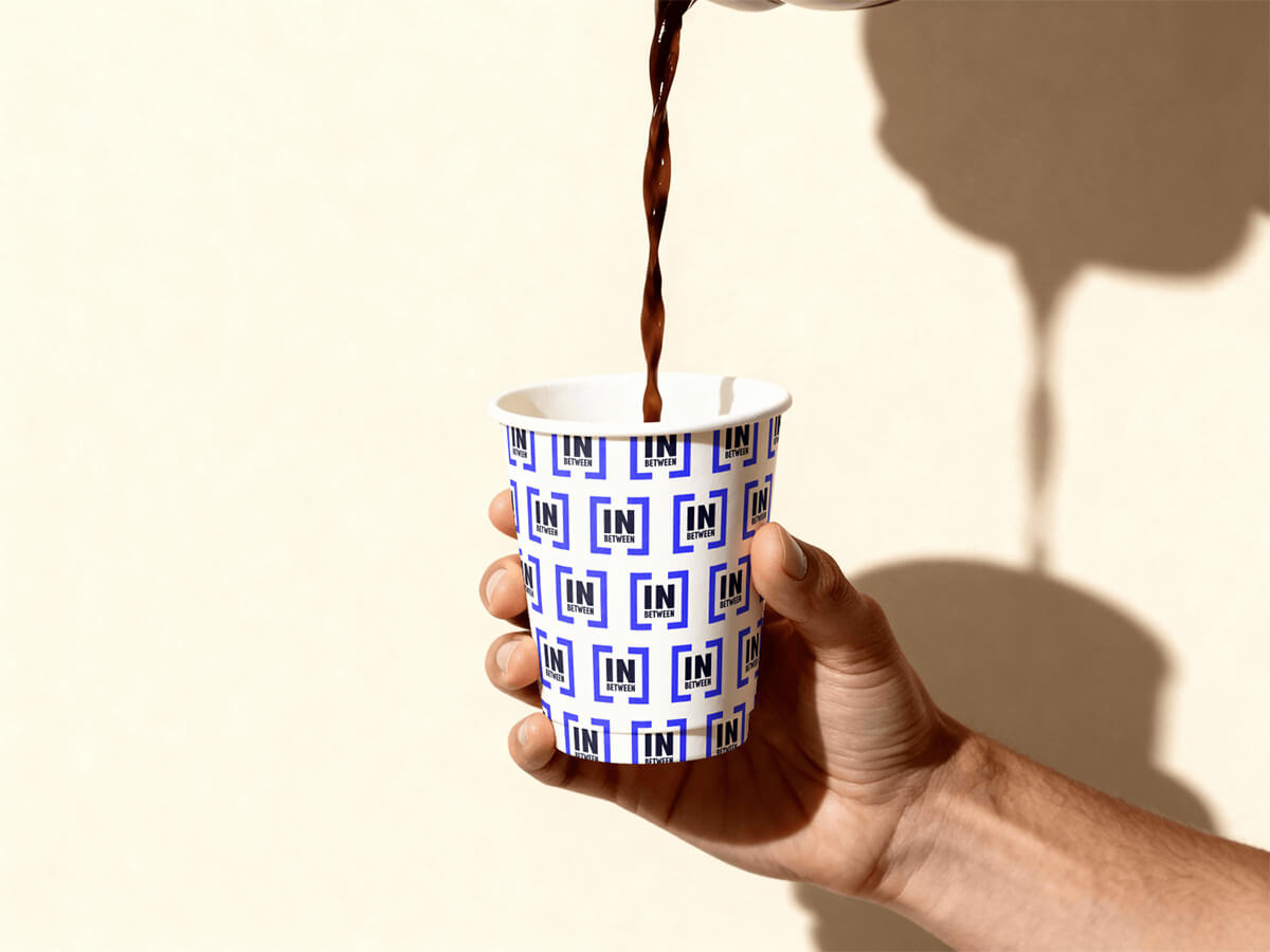 In Between packaging design on cup mockup